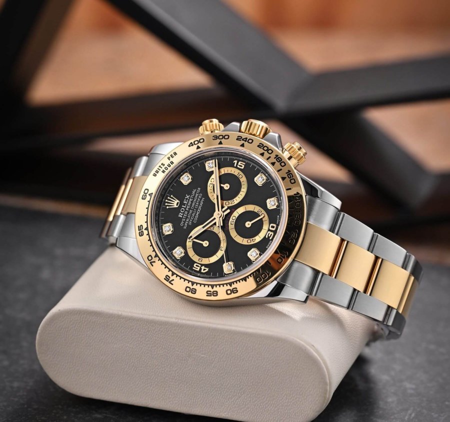 rolex daytona yellow gold black dial