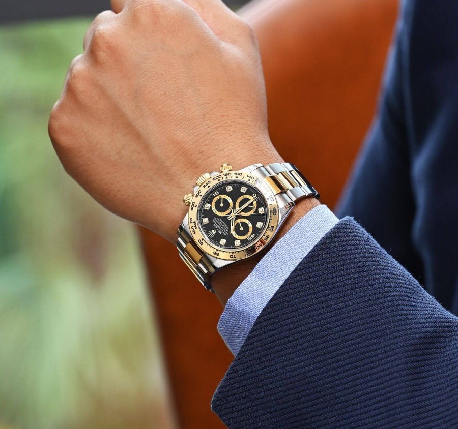 rolex daytona yellow gold black dial